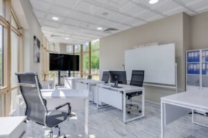 thi công trần thạch cao chống cháy giá bao nhiêu côn đảo | Spacious and bright modern office interior with sleek furniture, i