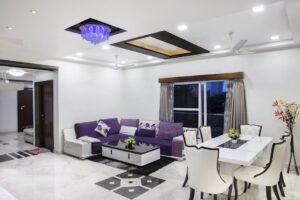 thi công trần thạch cao đơn giản chuyên nghiệp phường 8 vũng tàu | Elegant living room with modern decor, featuring a purple