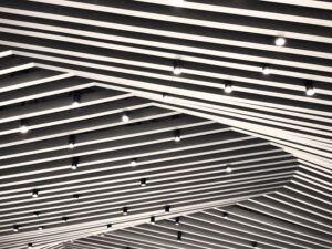báo giá đóng vách thạch cao phú mỹ | Abstract view of a modern striped ceiling featuring spotlights. Perfect for architecture