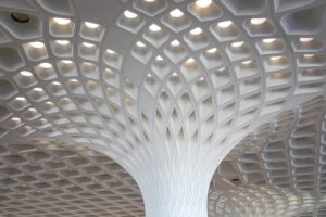 báo giá thi công vách thạch cao phú mỹ | Intricate modern ceiling design at Mumbai Airport showcasing architectural excellenc