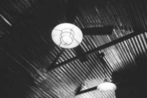 báo giá làm vách thạch cao long hải | Monochrome shot of pendant lights on a metal ceiling, Groesbeck, TX.