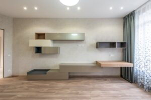 báo giá thi công trần nhựa ngãi giao | Minimalist design of contemporary room with modern cabinets and shelves placed near wi