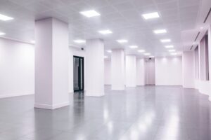 báo giá thi công trần thạch cao nhà hàng phước thái | Wide-angle view of a modern minimalist white office space with clean li