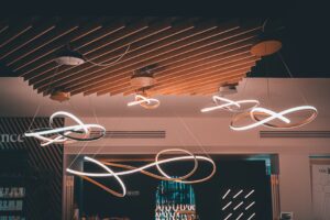 báo giá thi công trần thạch cao nhà phố long hải | Elegant spiral hanging lights with a modern design in a London interior sp