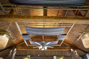 báo giá vách thạch cao tại long hải | From below of bright chandelier with decorative fabric hanging on wooden roof with glow